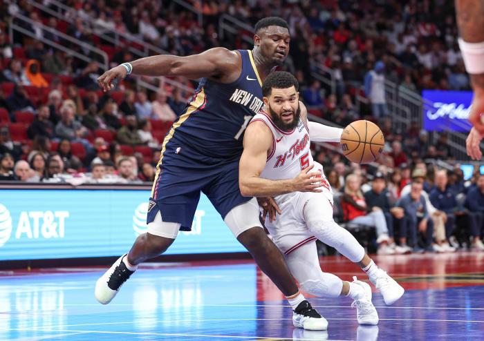 Rockets guard Fred VanVleet drives with the ball as New Orleans Pelicans forward Zion Williamson (1) defends during the third quarter at Toyota Center.